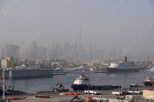View of Dubai Port with Burj Khalifa and city skyline in background, Dubai, UAE photo