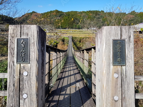 Wooden Suspension Bridge above the Ogata River at Harajiri Falls photo