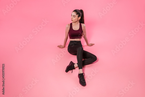 Full-length portrait of athletic sportswoman