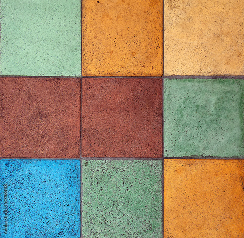 Colorful pastel tiles in square grid pattern.
