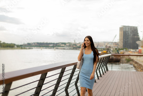 Young woman using a mobile ...