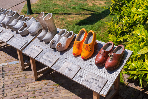 Obraz na płótnie Clogs on display at the Keukenhof Gardens complex in Lisse, South Holland, The Netherlands on spring day. Keukenhof is one of the world's largest flower gardens, open annually from March to May. w salonie