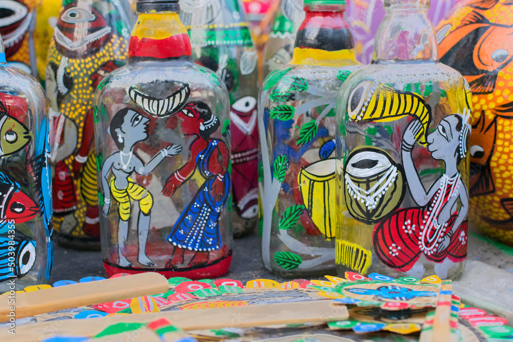 Fototapeta premium Bright colorful terracotta bottles, works of handicraft, on display during Handicraft Fair in Kolkata - the biggest handicrafts fair in Asia.
