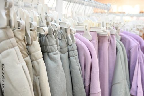 Women clothing on hangers in a boutique store. Sale of women's clothing. Casuale style photo