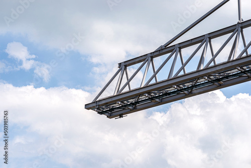 The end of the truss of a container crane on rails on the banks of the Rhine in Germany.