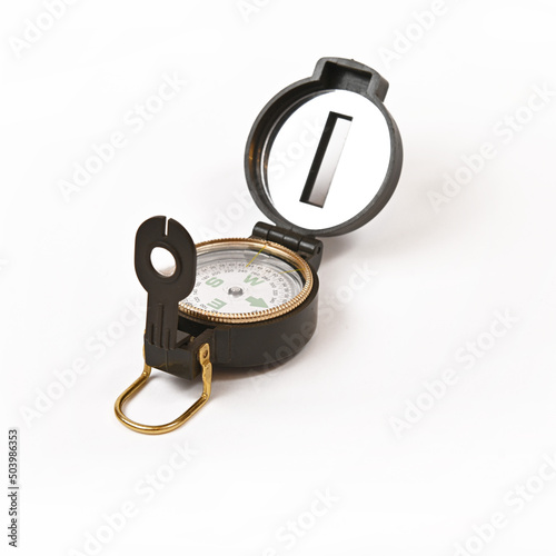 Tourist magnetic compass with a heliograph on a white background.Isolate.