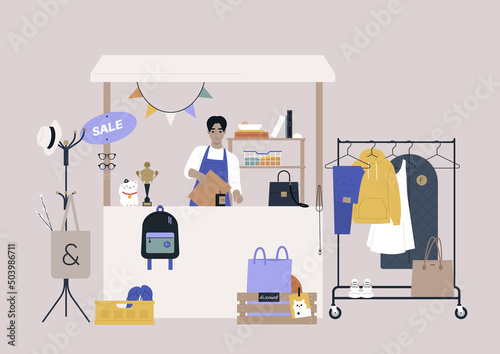 A thrift shopping concept, a Sunday market stand with used clothes and accessories