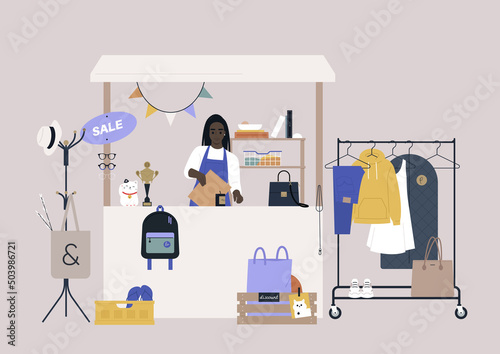 A thrift shopping concept, a Sunday market stand with used clothes and accessories