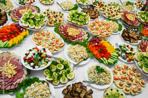 delicious dishes on the festive table. different food on the wedding table. the concept of celebrating an important event. buffet table with sandwiches and cold cuts