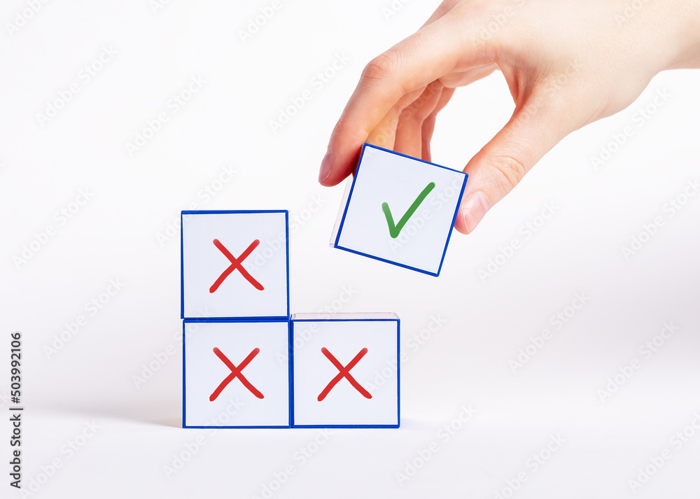 Hand taking cube with check mark instead of blocks with cross. Positive  decision, approval, confirmation, right answer concept. High quality photo  Stock Photo | Adobe Stock