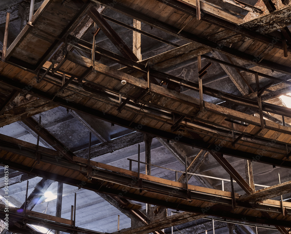 Metal wooden ceiling construction in an abandoned building. Metal wooden ceiling construction in an abandoned building.
