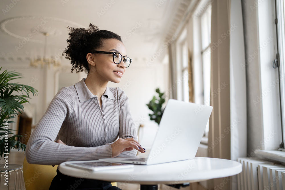 Online training a smart woman with glasses uses the school's website, a video call via the Internet Online training a smart woman with glasses uses the school's website, a video call via the Internet