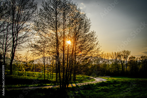 Fototapeta Naklejka Na Ścianę i Meble -  A winding road to Kalna at sunset