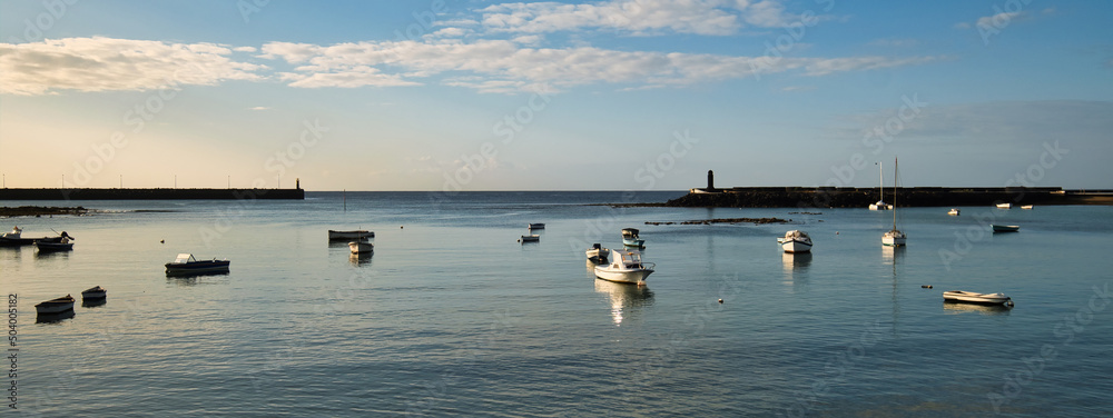 Fishing boats docked in bay. Arrecife town. Lanzarote Island Fishing boats docked in bay. Arrecife town. Lanzarote Island