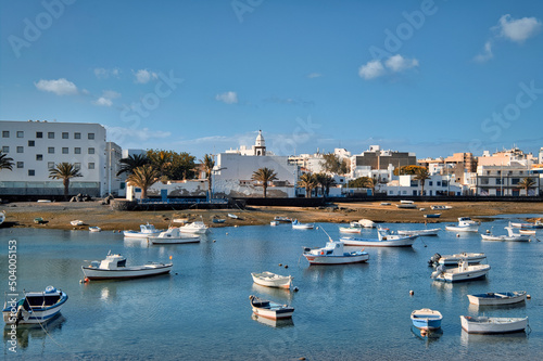 Fishing boats docked in bay. Arrecife town. Lanzarote Island photo