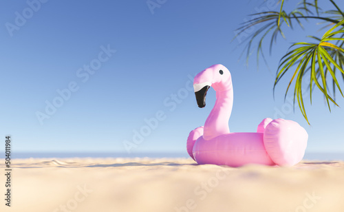 Flamingo float on sandy beach © TheCatEmpire Studio