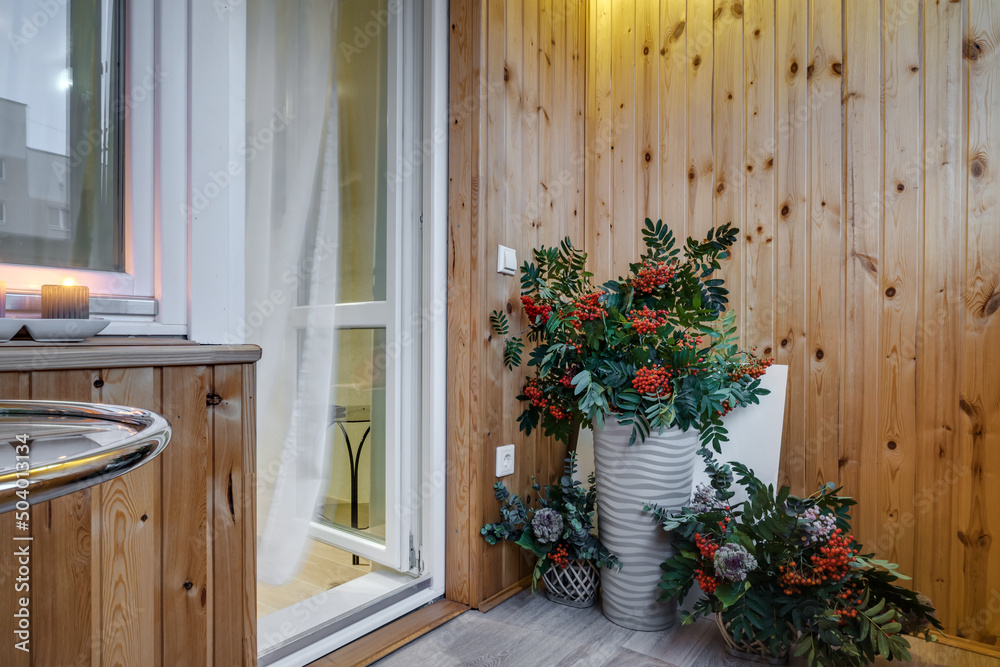 Naklejka premium vase with a bouquet of flowers in the interior