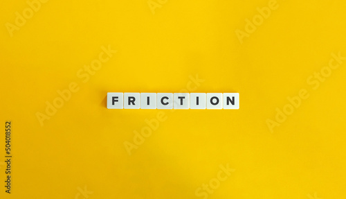 Friction Word and Banner. Letter Tiles on Yellow Background. Minimal Aesthetics. photo