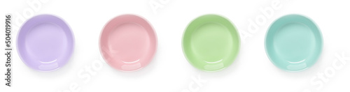 Set of multicolored ceramic bowls isolated on a white background. Empty colorful porcelain ramekins cutout. Pastel colored dishes and tableware for food design. Modern crockery.