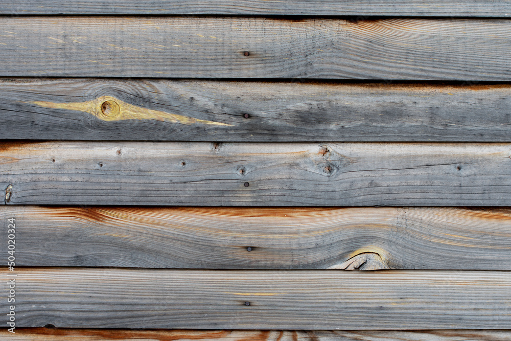 Obraz premium the texture of the wooden facade of the house from the boards, photophone banner wooden