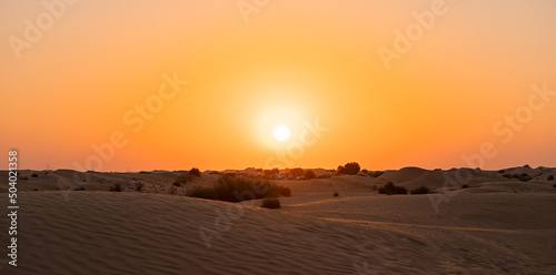 Desert sunset with empty dunes in Dubai or Abu Dhabi, United Arab Emirates