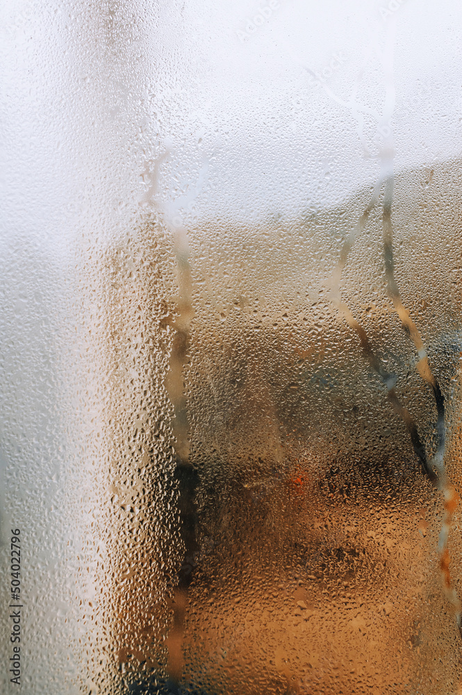 Background, texture of a drop of water, streaks and rain on glass, window. Photography, abstraction.