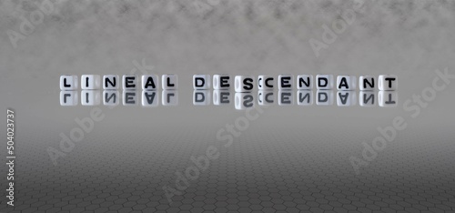 Fotografia lineal descendant word or concept represented by black and white letter cubes on