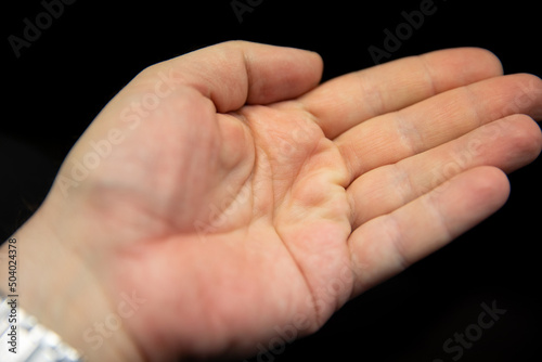 A man's hand shows gestures.