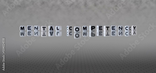 mental competency word or concept represented by black and white letter cubes on a grey horizon background stretching to infinity