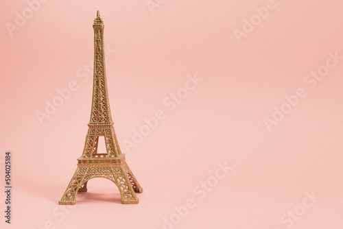golden effiel tower souvenir with pink background