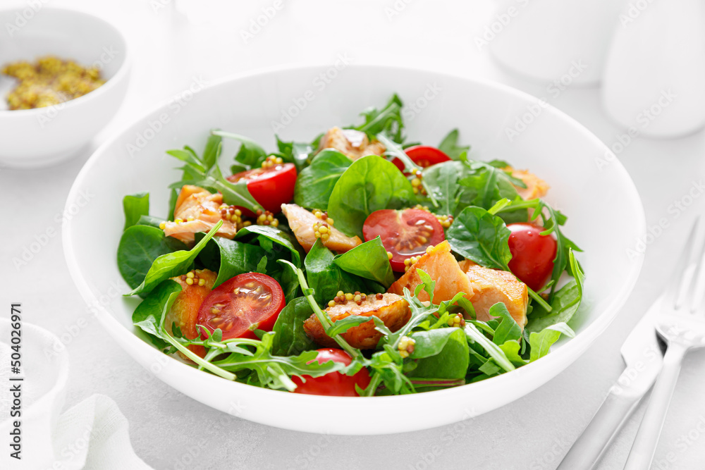 Grilled salmon salad with tomato and salad mix Grilled salmon salad with tomato and salad mix