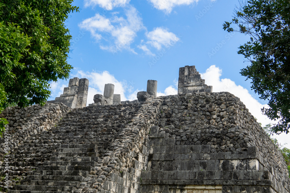 Prehistoric Mayan ruin at Chichen Itza, Yucatan, Mexico. Unfinished Mayan step pyramid. A dilapidated sacrificial altar.
