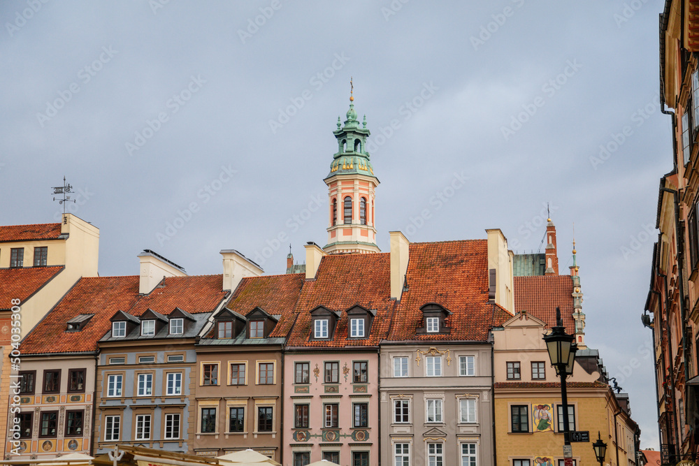 Warsaw, Poland, 13 October 2021: Main market square with fountain in old town, medieval colorful historic renaissance baroque buildings at sunny day, UNESCO World Heritage Site, ancient architecture