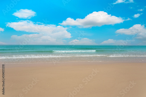 tropical paradise beach with white sand and blue sky and cloud background.