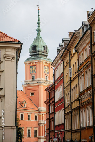 Warsaw, Poland, 13 October 2021: Royal Castle with clock tower in old town, residence official home of Polish monarchs, fortified complex at sunny autumn day, Main square with Sigismund Column