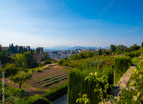 Aerial view of the city with historic center of Granada with some part of Alcazaba castle and Sierra Nevada on background