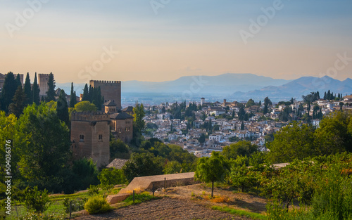 Aerial view of the city with historic center of Granada with some part of Alcazaba castle and Sierra Nevada on background