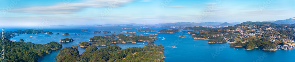 Long exposure photography of a panorama bird's-eye view of the Kujūkushima seascape with islands that lie off sasebo famous for its saw-toothed coast part of Saikai National Park in Kyushu.