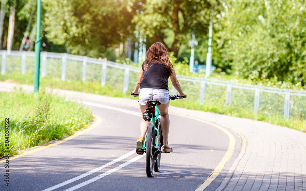 Cyclist ride on the bike path in the city Park
