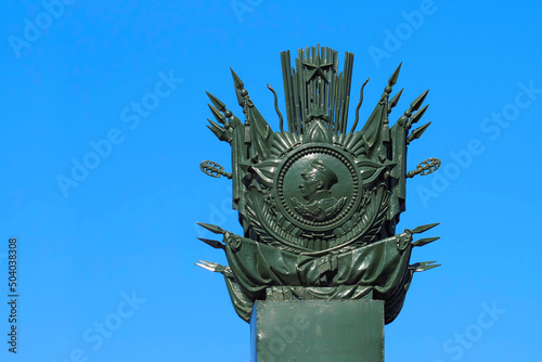 Ushakovsky bridge across the Bolshaya Nevka river in St. Petersburg. Column with a bas-relief image of the Order of Ushakov photo