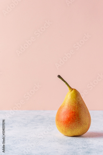 ripe pear on a colored background