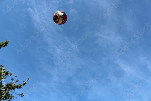 Ball with the name of Portugal, in the air with blue sky background