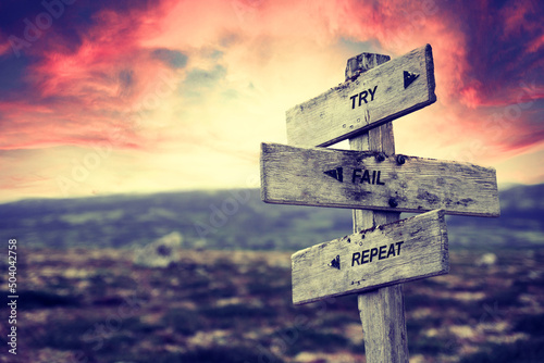 try fail repeat text quote caption on wooden signpost outdoors in nature. Stock sign words theme.