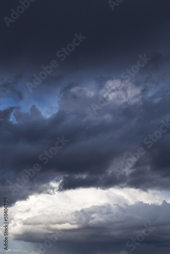 Storm cloudy dramatic sky with dark rain grey cumulus cloud and blue sky background texture, thunderstorm, heaven © Viktor Iden
