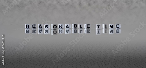 reasonable time word or concept represented by black and white letter cubes on a grey horizon background stretching to infinity