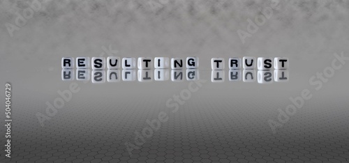 resulting trust word or concept represented by black and white letter cubes on a grey horizon background stretching to infinity