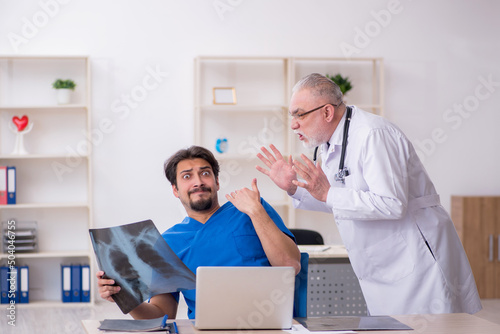 Two male doctors working in the clinic