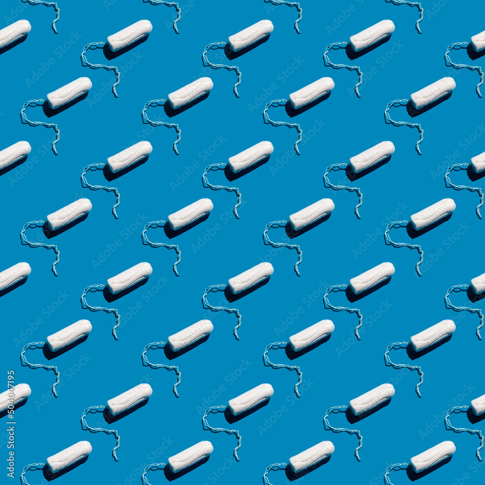 Seamless pattern of cotton tampons on a blue solid background. Feminine hygiene care. Menstrual cycle. Female health, menstruation concept. Hard shadow.