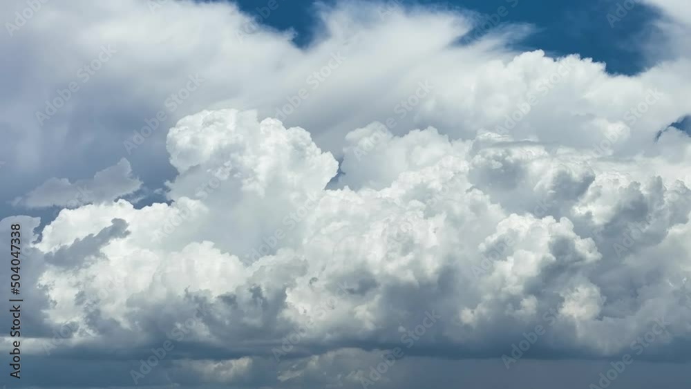 Timelapse of white puffy cumulus clouds forming on summer blue sky. Moving and changing cloudscape weather Timelapse of white puffy cumulus clouds forming on summer blue sky. Moving and changing cloudscape weather