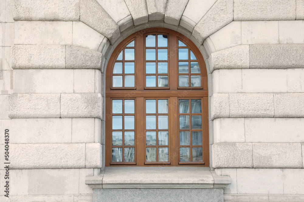 View of beautiful arched window in building outdoors